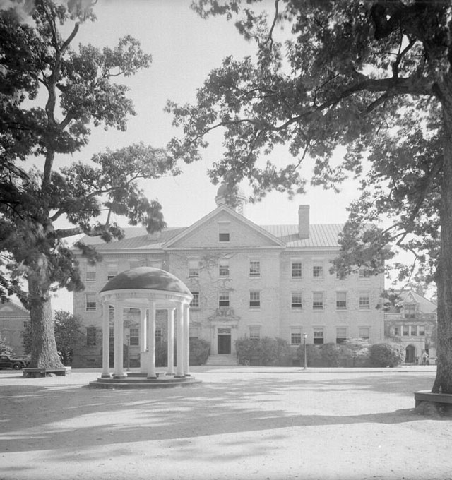 Photo showing the Old Well and Old West building on UNC’s campus in Chapel Hill